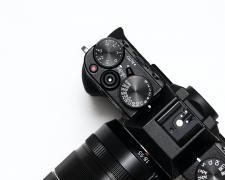 close up, top view of a Fuji mirrorless camera.